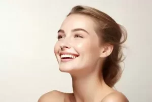 A client smiling after treatment