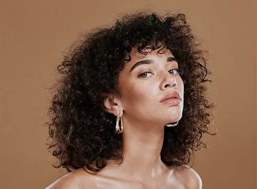 A woman with clear, glowing skin after a facial